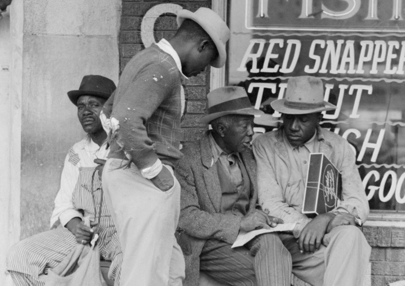 Men in front of fish market