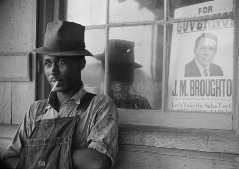 Man in front of window